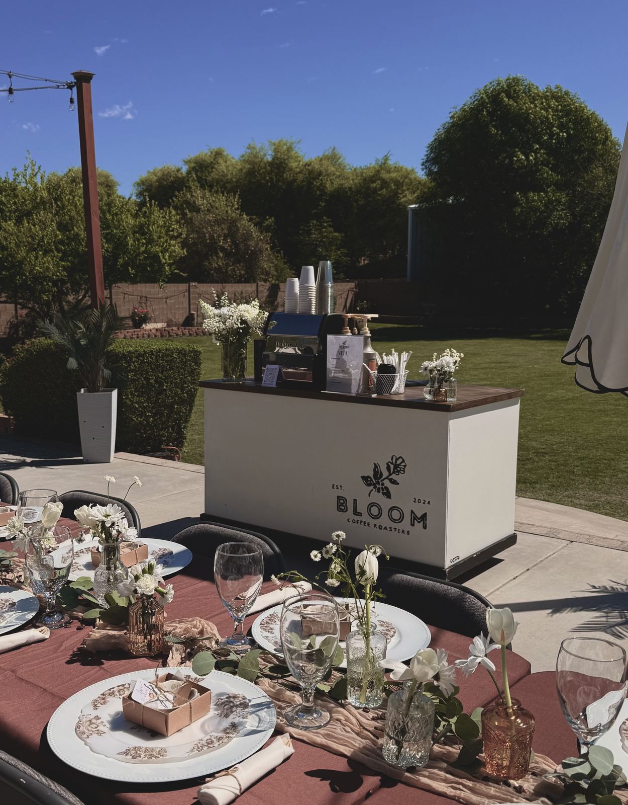 Bloom coffee cart at an outdoor wedding reception