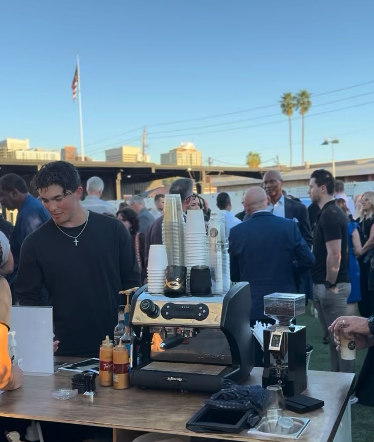 Bloom barista serving guests at an outdoor evening event in downtown Phoenix