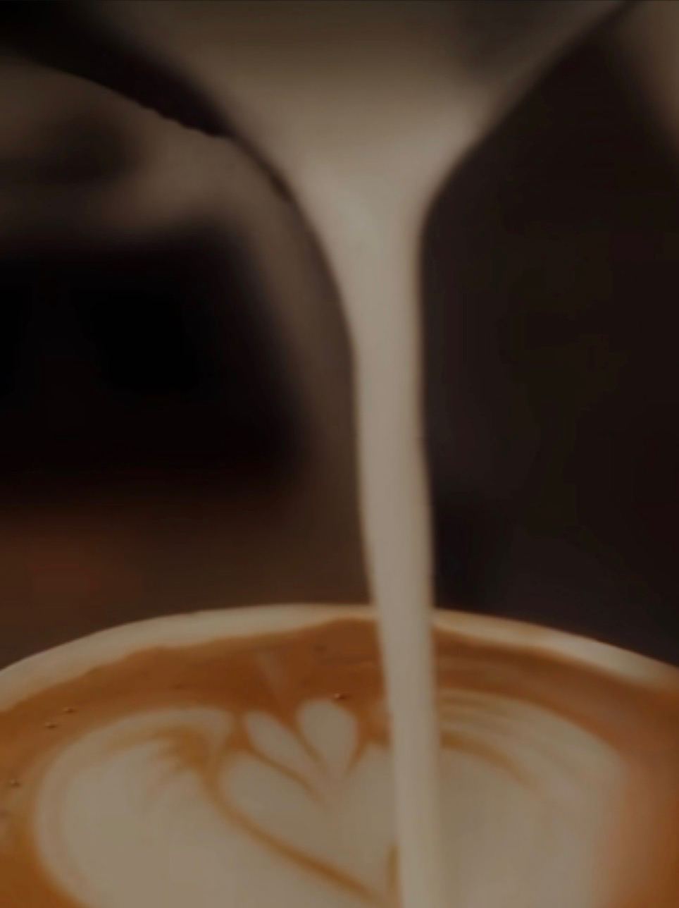 Milk pouring into latte art