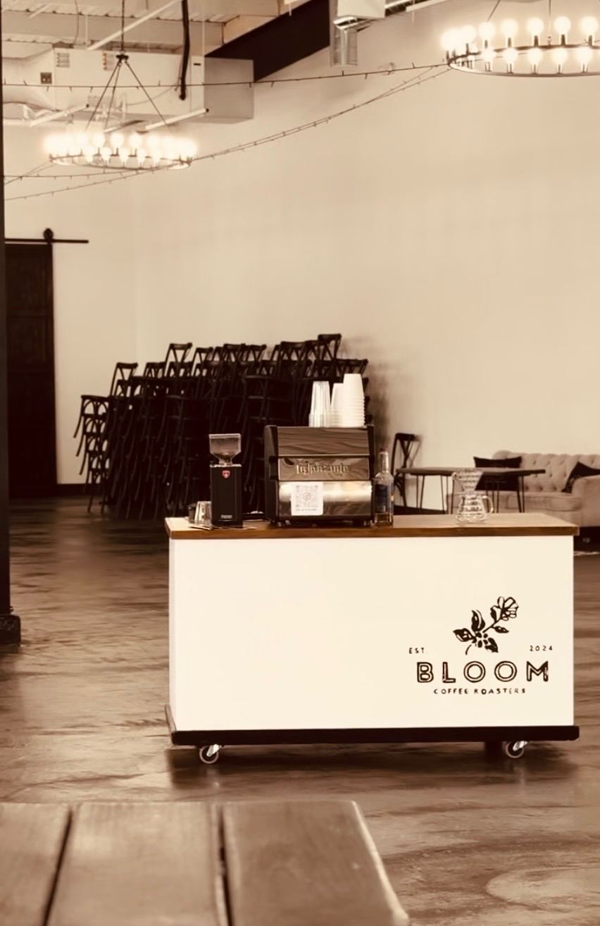 Bloom Coffee Roasters cart in an elegant wedding venue with chandeliers